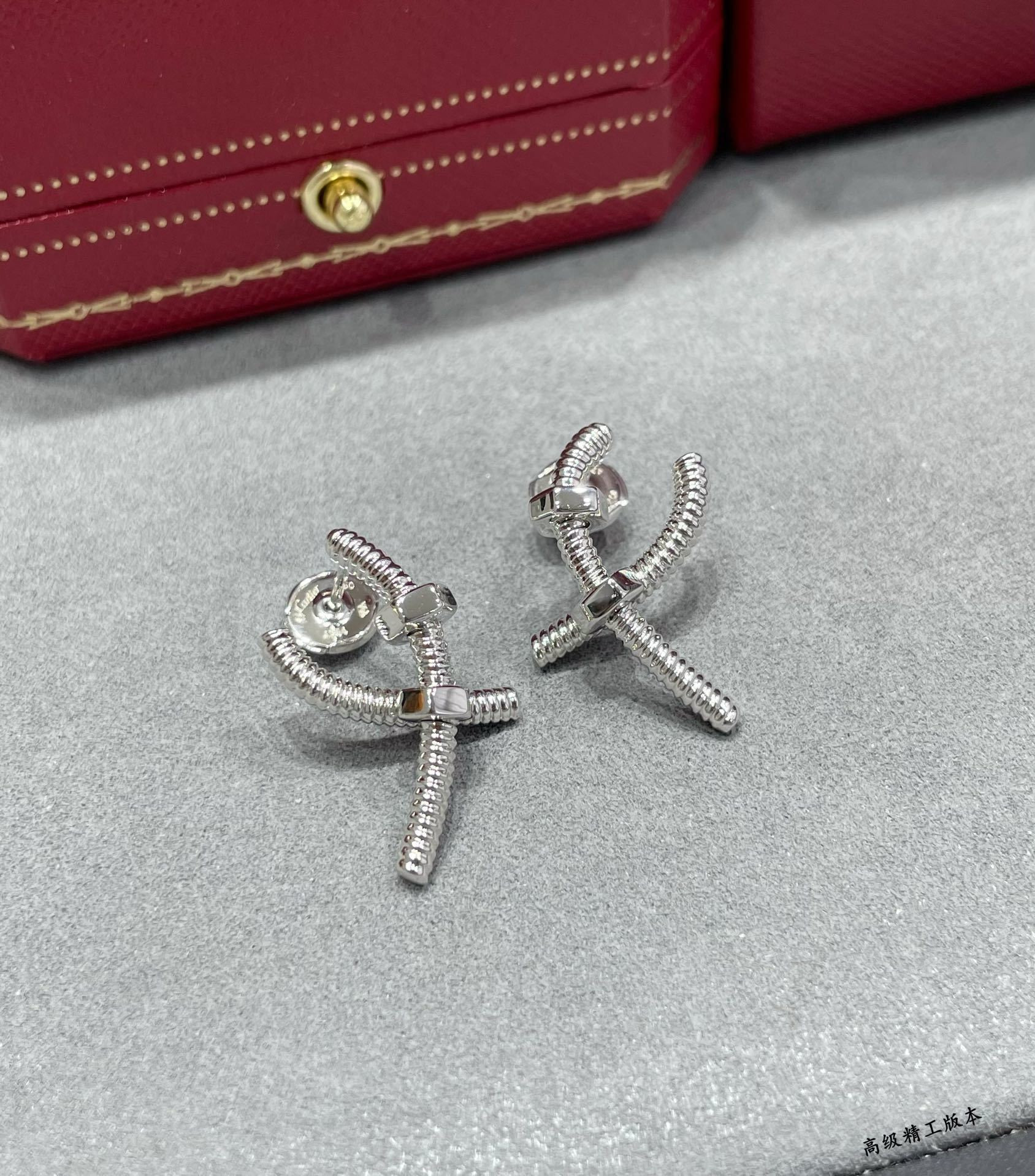 Ca*t1er Cross Screw Earrings